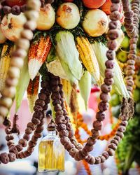 Close-up of fruits hanging at market stall