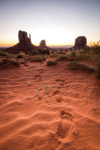 Rock formations in desert during sunset