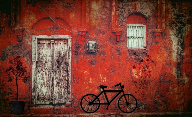 building exterior, architecture, built structure, window, bicycle, door, house, closed, wall - building feature, transportation, stationary, wall, mode of transport, residential structure, orange color, land vehicle, brick wall, old, entrance, building