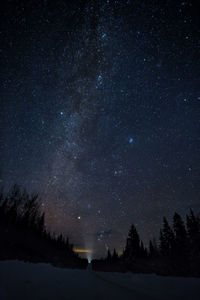 Scenic view of lake against star field at night