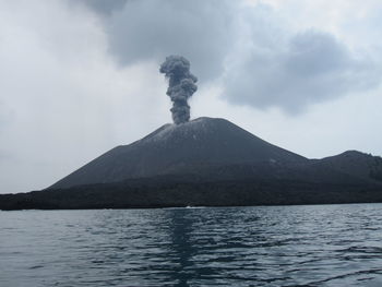 Scenic view of volcanic mountain against sky