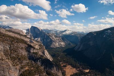 Scenic view of mountains against cloudy sky