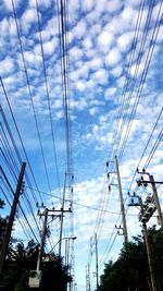 Low angle view of electricity pylon against sky