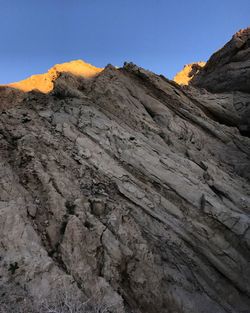 Low angle view of mountain against clear sky