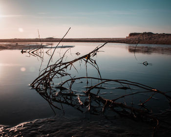 Scenic view of lake against sky during sunset