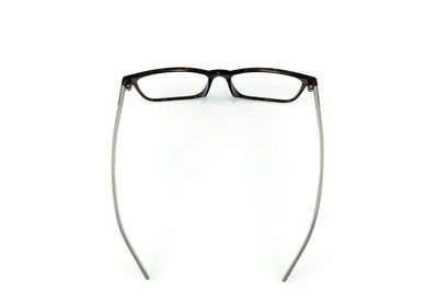 Close-up of eyeglasses over white background