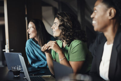 Businesswomen looking away during meeting at office