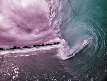 Scenic view of sea against cloudy sky