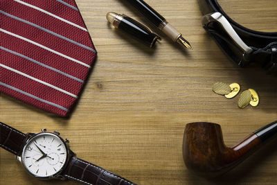 High angle view of clock on table