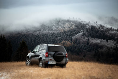 Car on land by mountain