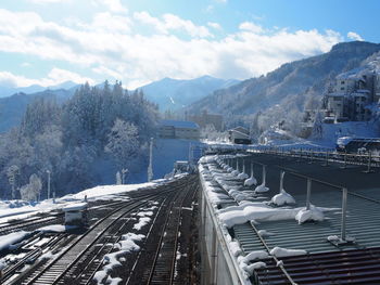 High angle view of railroad tracks against mountain during winter