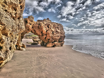 Scenic view of sea against cloudy sky