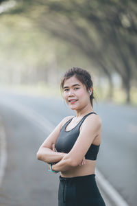 Portrait of young woman standing outdoors