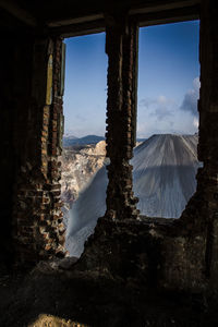 Scenic view of landscape seen through window