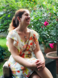 Portrait of a smiling young woman outdoors