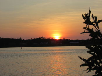 Scenic view of sea against orange sky