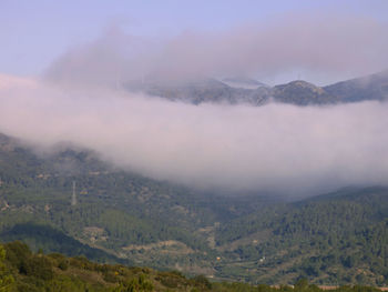 Scenic view of mountains during foggy weather