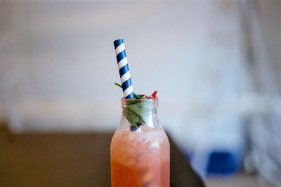 Close-up of glass bottle against blurred background