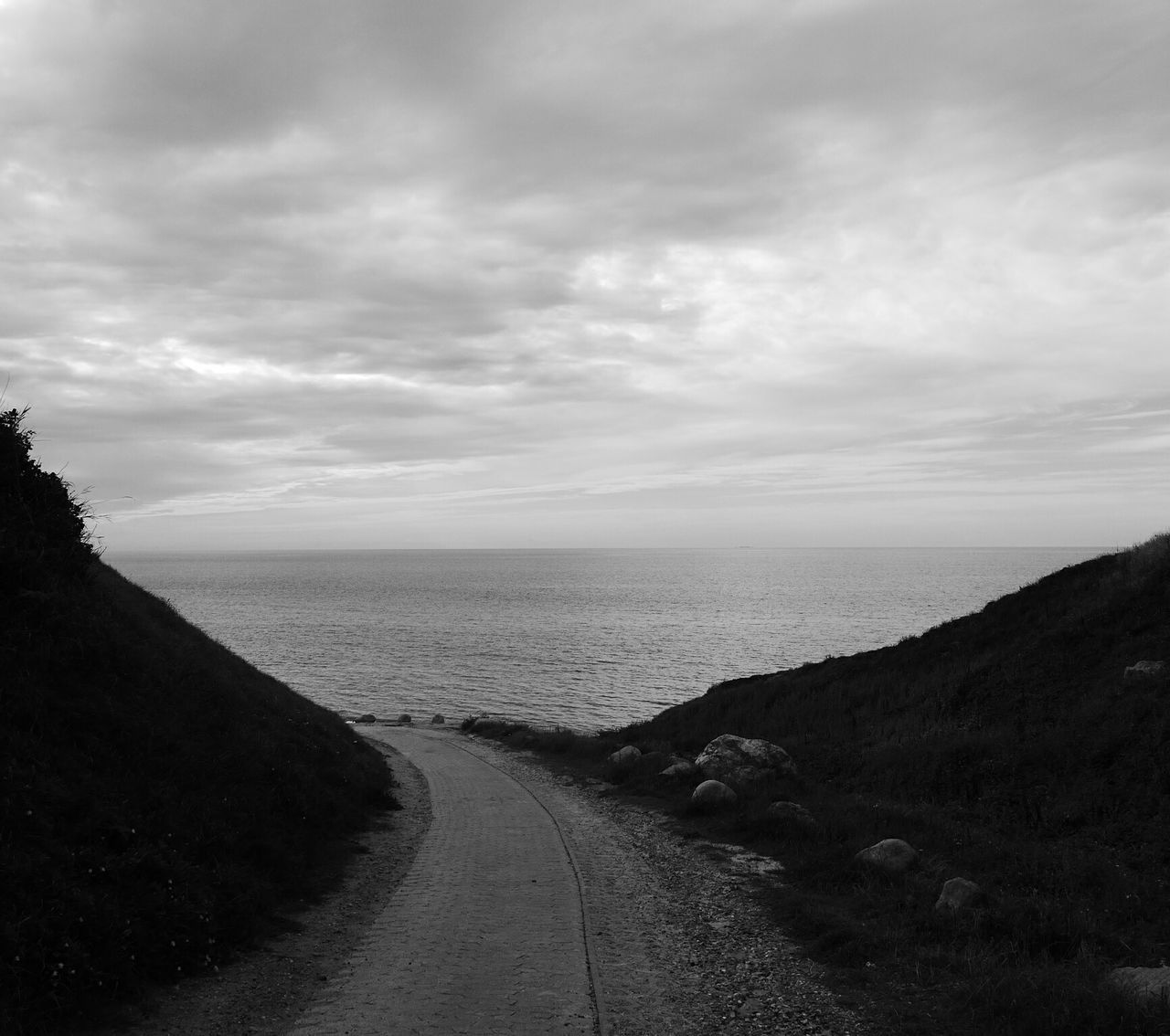 sea, sky, horizon over water, water, tranquil scene, tranquility, scenics, cloud - sky, cloudy, beauty in nature, the way forward, nature, beach, cloud, shore, overcast, idyllic, weather, remote, outdoors