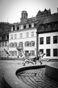 View of swimming pool against buildings in city