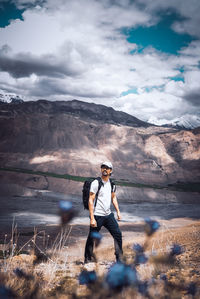 Rear view of man standing on mountain