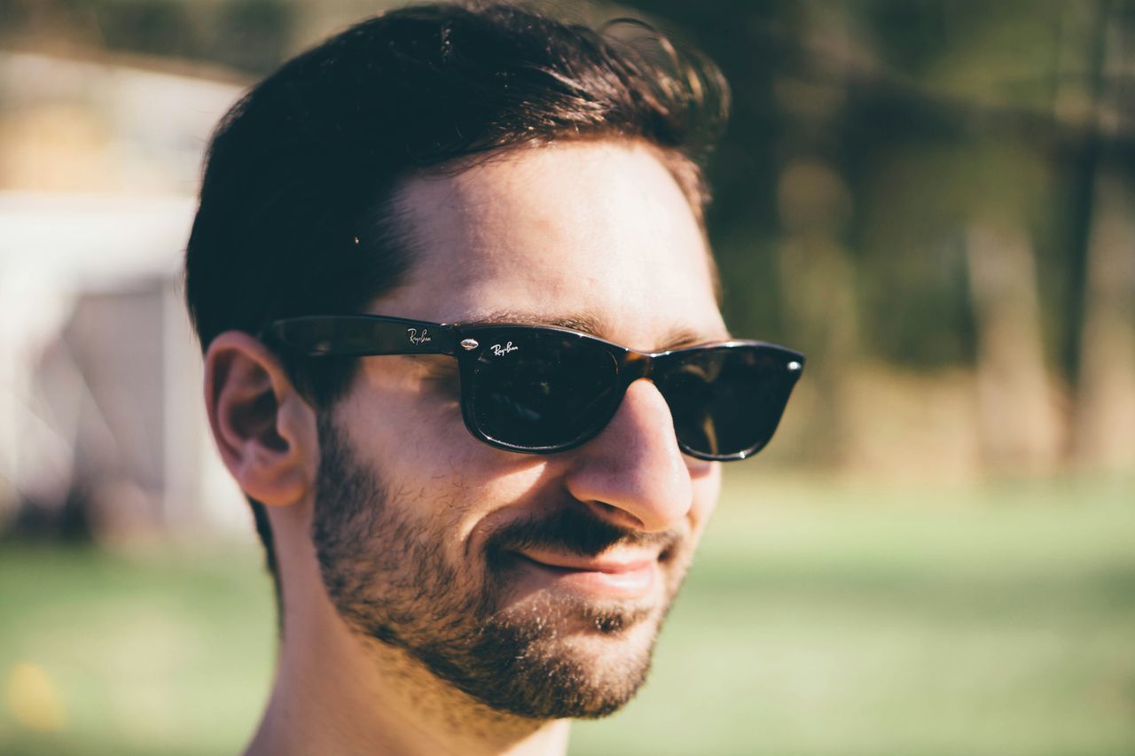 focus on foreground, headshot, portrait, looking at camera, close-up, lifestyles, young adult, young men, leisure activity, person, sunglasses, front view, human face, beard, head and shoulders, mid adult men, stubble, mid adult