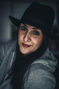 Portrait of young woman wearing hat