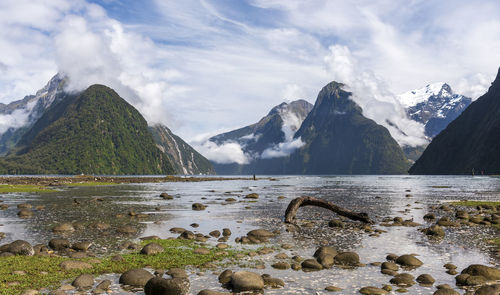 Scenic view of lake and mountains against sky