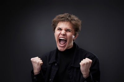 Portrait of young man against white background