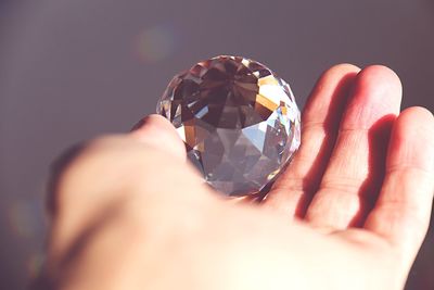 Close-up of person holding crystal