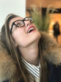 Close-up of young woman in eyeglasses