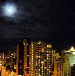 Low angle view of modern buildings against sky at dusk