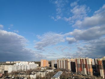 Buildings in city against sky