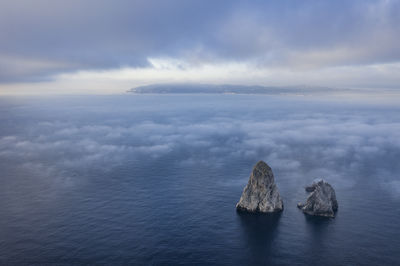 Aerial view of the medes islands in a foggy sunrise over the costa brava coast and mediterrania sea