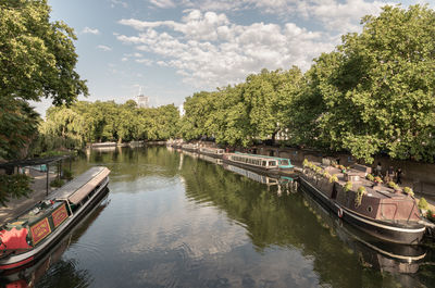 Boats moored in river