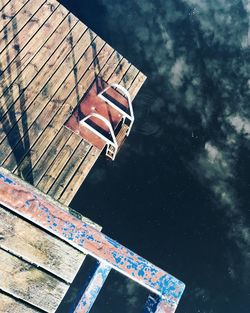 High angle view of ladder on pier at lake