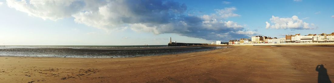 Panoramic view of beach against sky