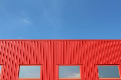 Red building against sky