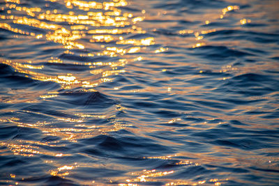 Full frame shot of illuminated sea at sunset