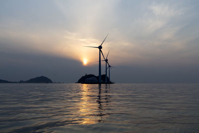 Scenic view of sea against sky during sunset