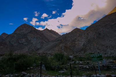 Low angle view of mountains against blue sky