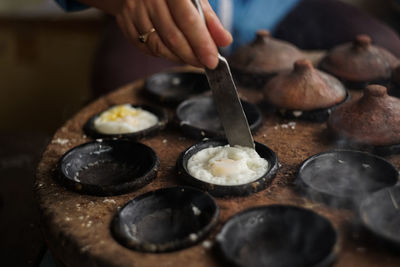 Close-up of person preparing food