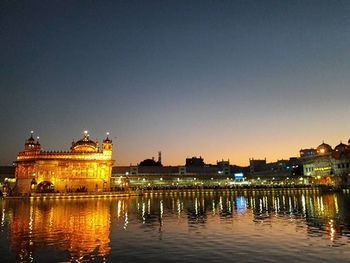 Reflection of illuminated buildings in water