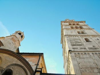 Low angle view of building against blue sky