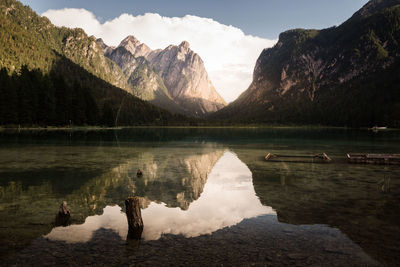Scenic view of lake and mountains against sky