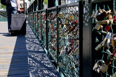 Close-up of padlocks on railing at pont des arts