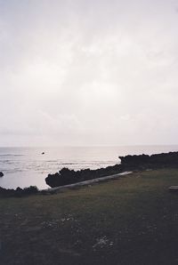 Scenic view of sea against cloudy sky