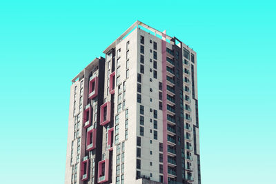 Low angle view of building against clear blue sky