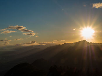 Scenic view of silhouette mountains against sky during sunset