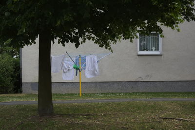 Laundry drying outside house